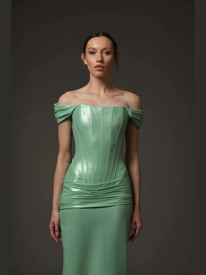 Green corseted dress.
