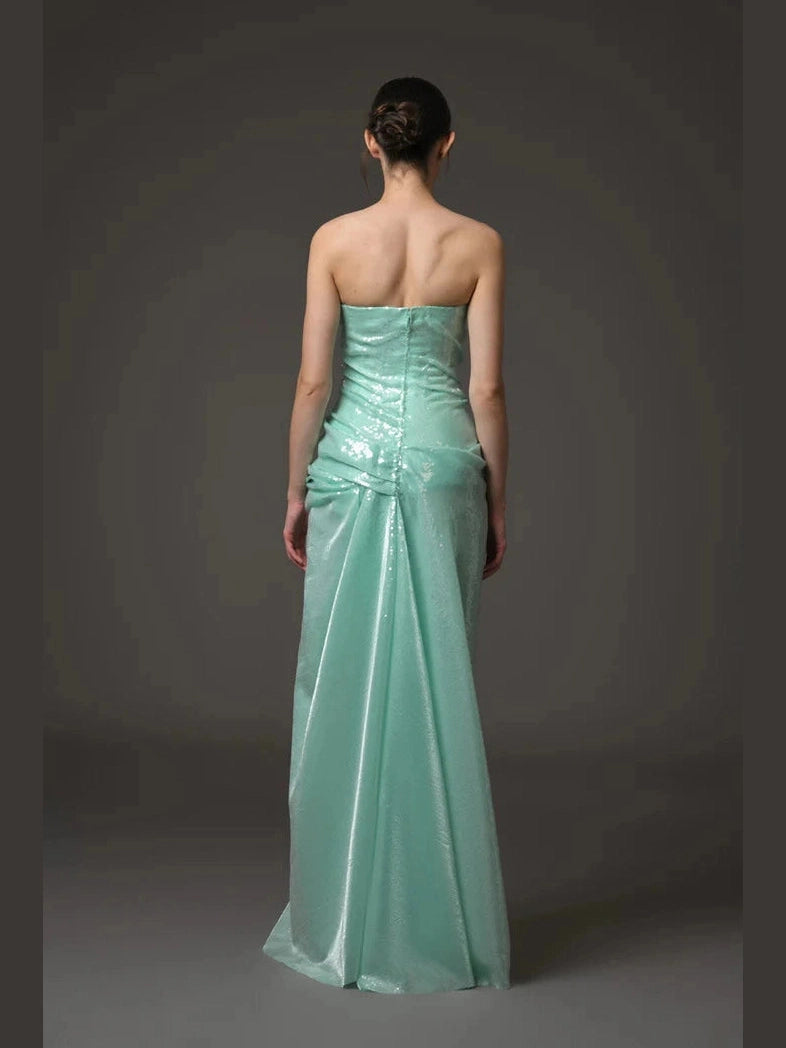 Green sequined corseted dress.