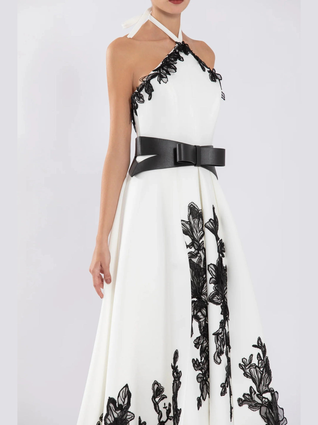 NEOPRENE
DRESS WITH PLEATED SKIRT AND BEADING